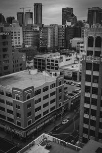 High angle view of buildings in city against sky