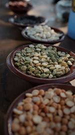 High angle view of lentils and beans in bowl on table