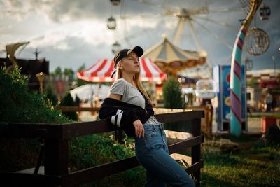 Woman sitting at amusement park