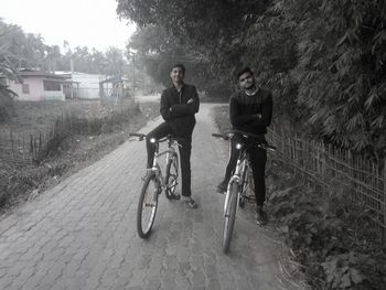 Portrait of people riding bicycle