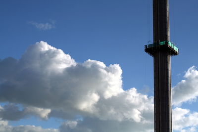 Low angle view of pole against blue sky