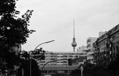 Fernsehturm tower amidst buildings against sky in city