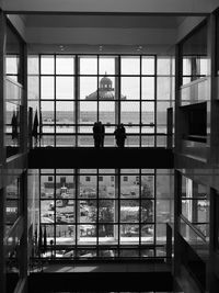 Reflection of building on glass window