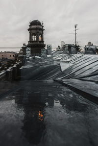 Built structure in sea against sky in city