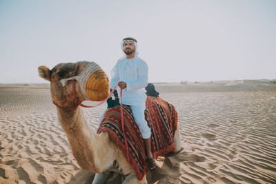 Man riding horse at dessert