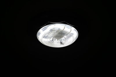 Low angle view of illuminated lights at night