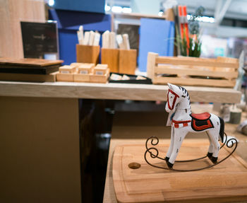 Close-up of chairs on table