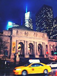 Buildings in city at night