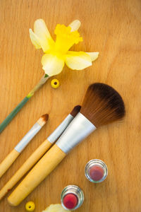 High angle view of yellow flower on table