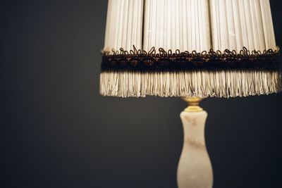 Close-up of illuminated lamp against black background
