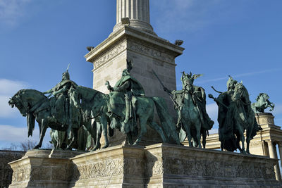 Low angle view of statue against sky