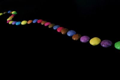 Close-up of multi colored lights against black background