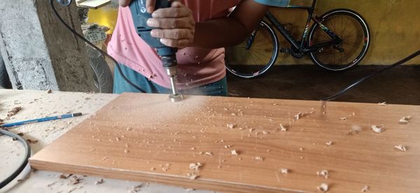 Man working on cutting board
