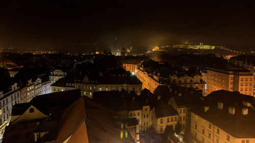 High angle view of buildings in city at night