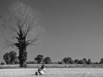 Rear view of man standing on road