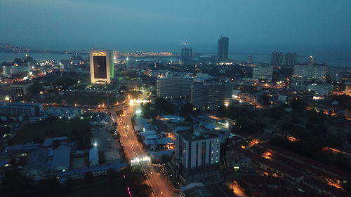 High angle view of illuminated buildings in city at night