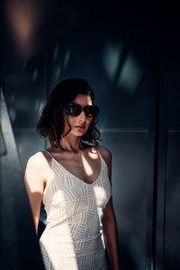 Portrait of young woman wearing sunglasses