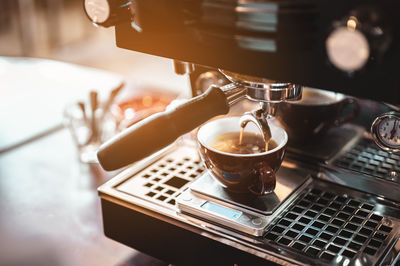 Close-up of coffee served on table in cafe