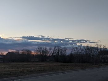 Scenic view of field against sky during sunset