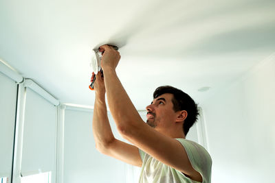 Low angle view of man working at home