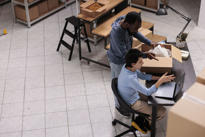 High angle view of man working in workshop