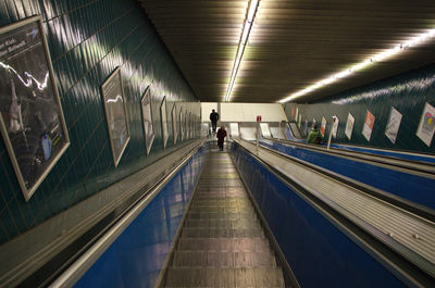 Rear view of woman walking in subway station