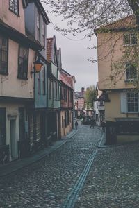 Street in city against sky