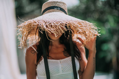 Portrait of woman wearing mask outdoors