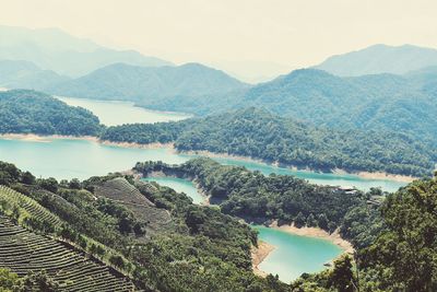 High angle view of lake with mountains in background