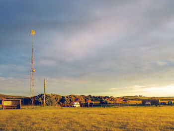 Scenic view of field against sky during sunset