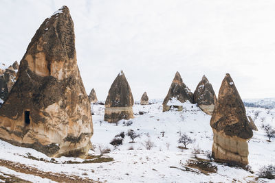 Panoramic view of temple against sky during winter