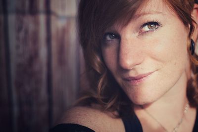 Close-up portrait of a smiling young woman