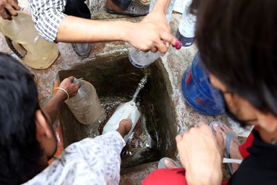 High angle view of people enjoying in water