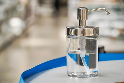 Close-up of water in glass bottle on table