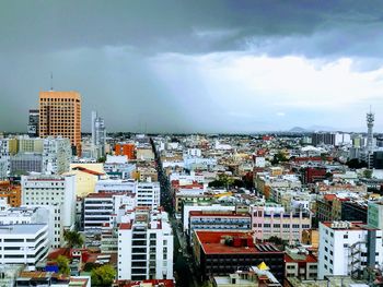 High angle view of buildings in city against sky