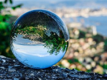 Close-up of crystal ball on rock