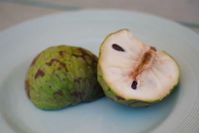 High angle view of fruit in plate on table