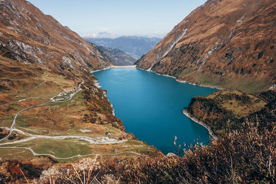 Scenic view of lake and mountains against sky
