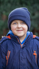 Portrait of boy standing outdoors
