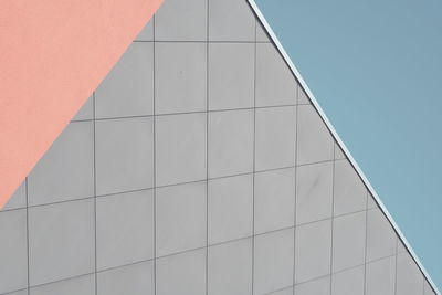 Low angle view of modern building against clear blue sky