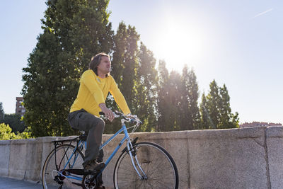 Caucasian man riding bicycle in the city