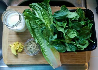 High angle view of vegetables on cutting board on table
