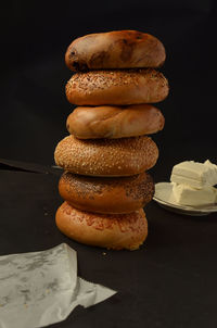 Stack of bagels on table