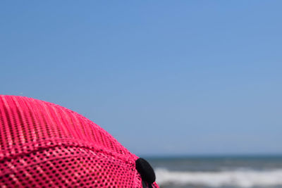 Close-up of blue sea against clear sky