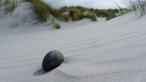 High angle view of pebbles on beach