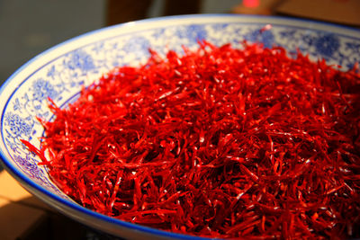 High angle view of red chili peppers in container