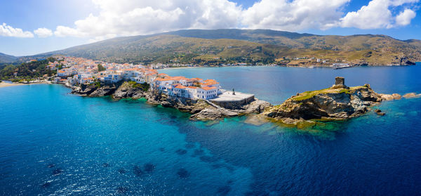 Panoramic view of sea and mountains against sky