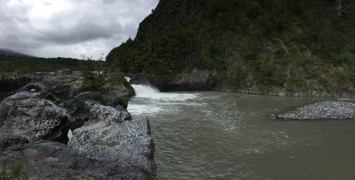 Scenic view of river flowing through rocks