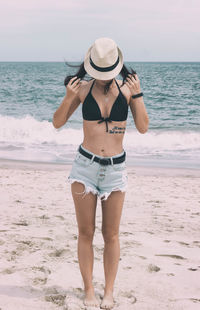 Woman standing on beach