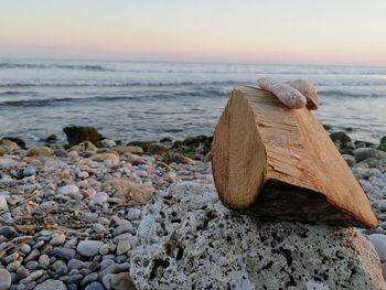 Scenic view of rocks on beach against sky